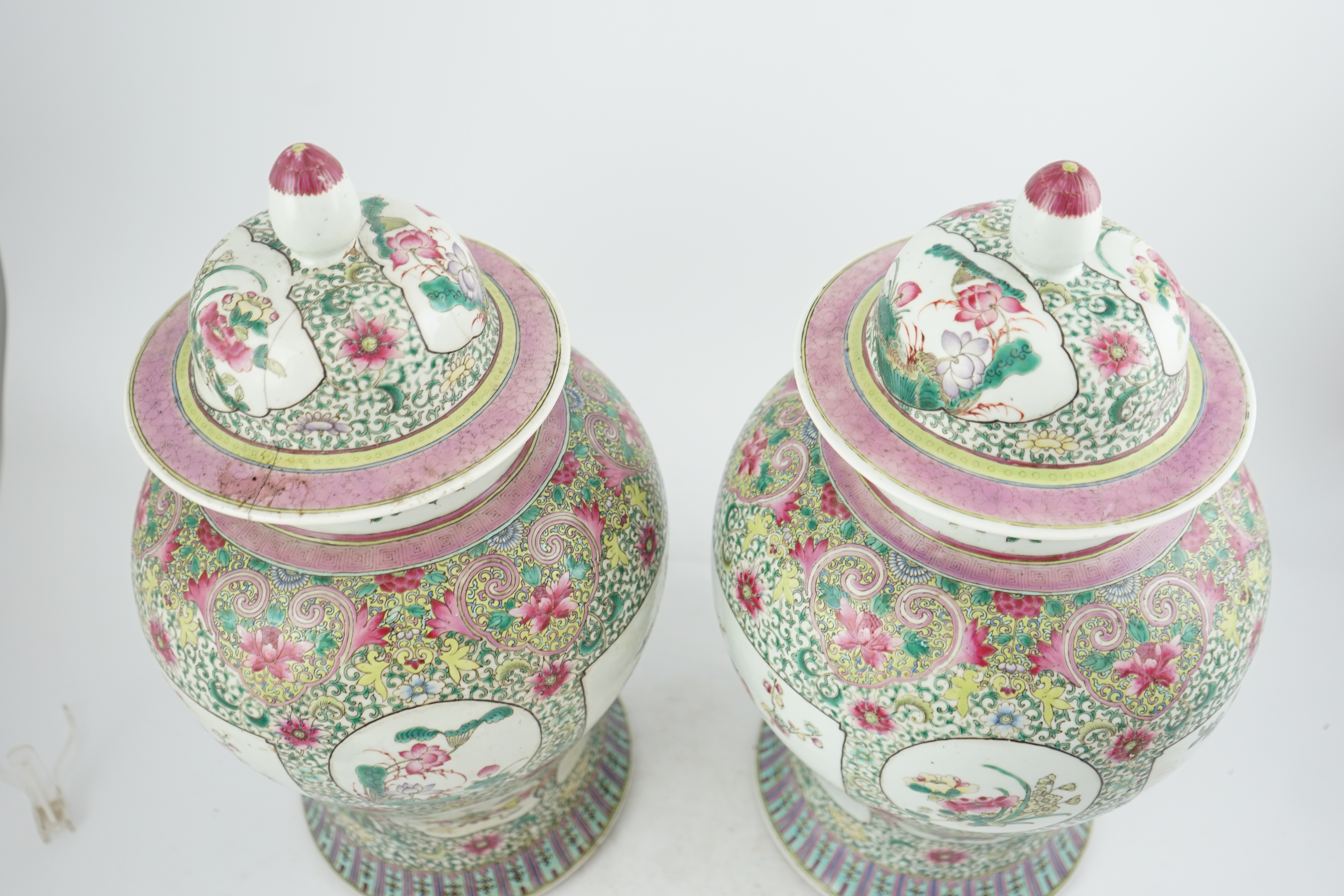 A pair of large Chinese famille rose baluster jars and covers, Qianlong seal mark, but late 19th century